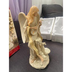 Porcelain Collectible Angel, made of fine ivory bisque whith hand painted,